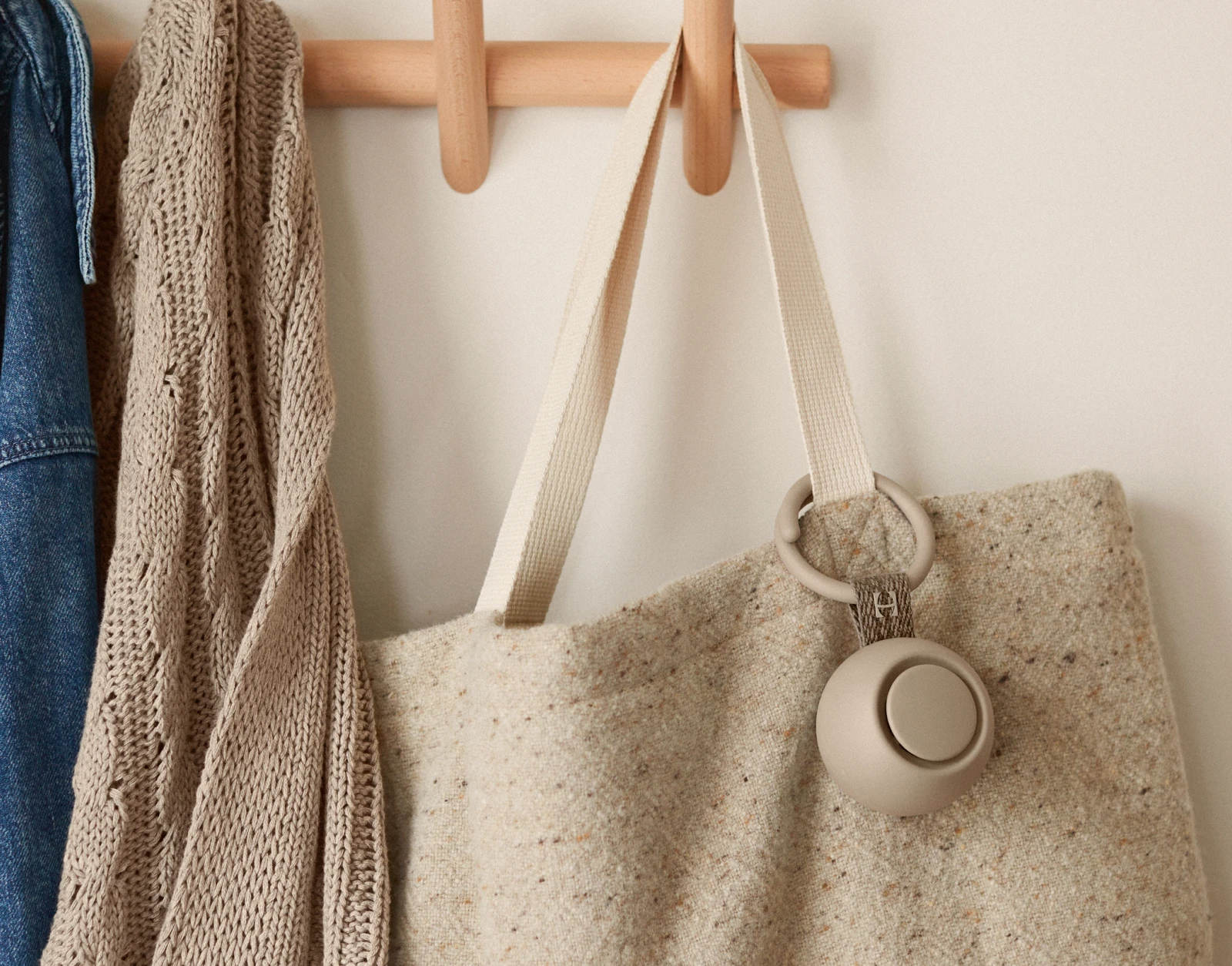 Hatch Go Greige clipped on a baby tote bag