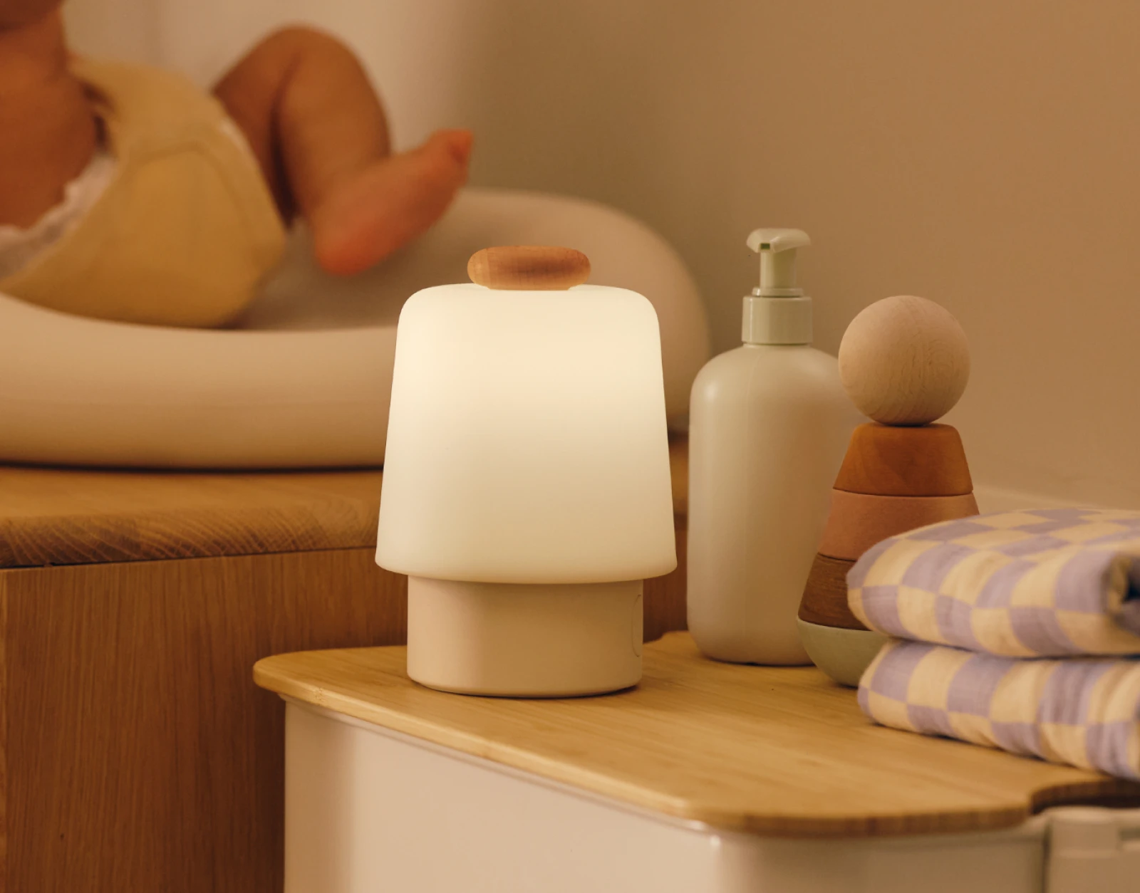 Hatch Baby Beechwood sitting on a nursery changing table