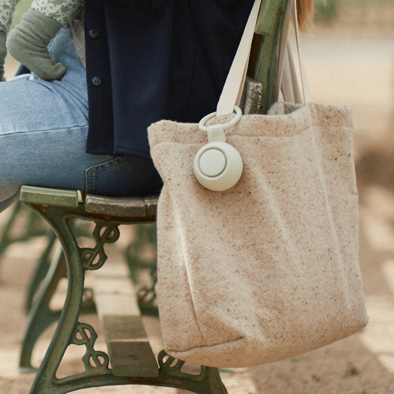 Hatch rest go in mint hanging from a mother's tote bag