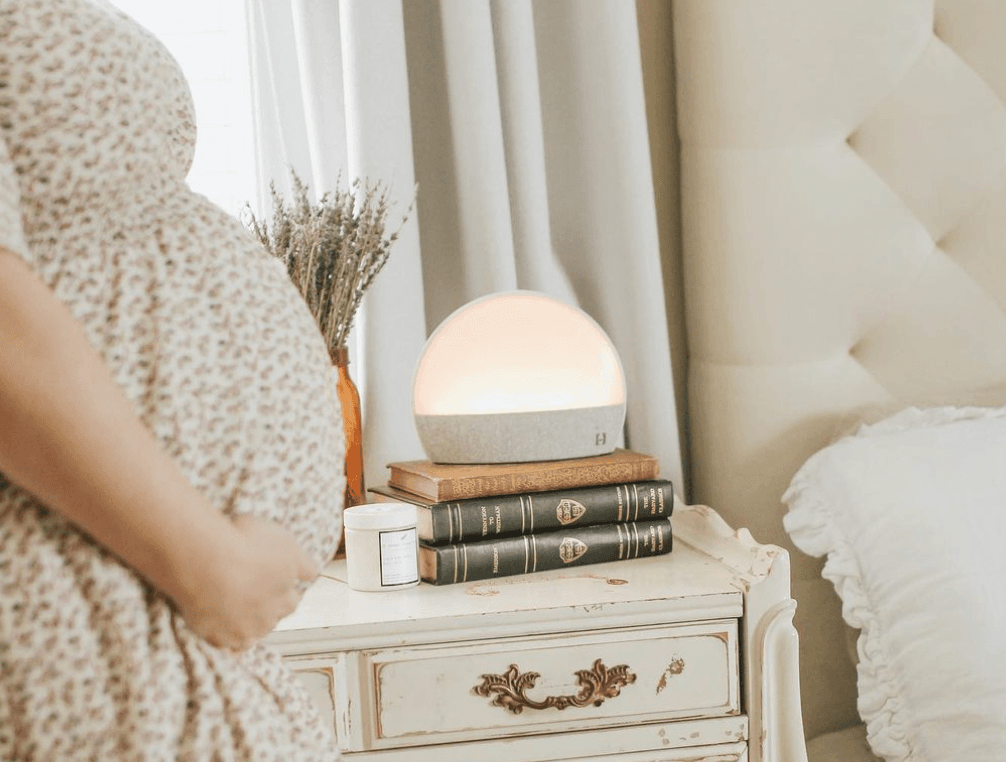 Hatch Restore sitting on a bedside table