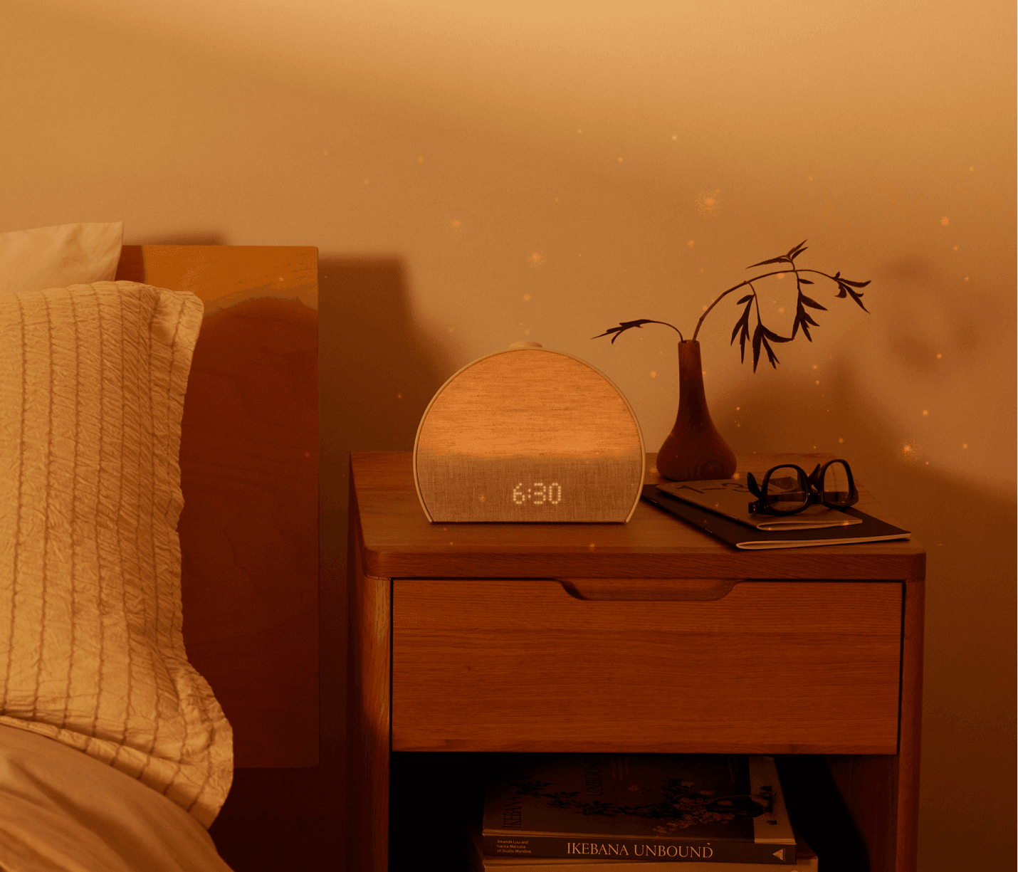 Restore 3 on a nightstand in the evening with meditative effects radiating from it
