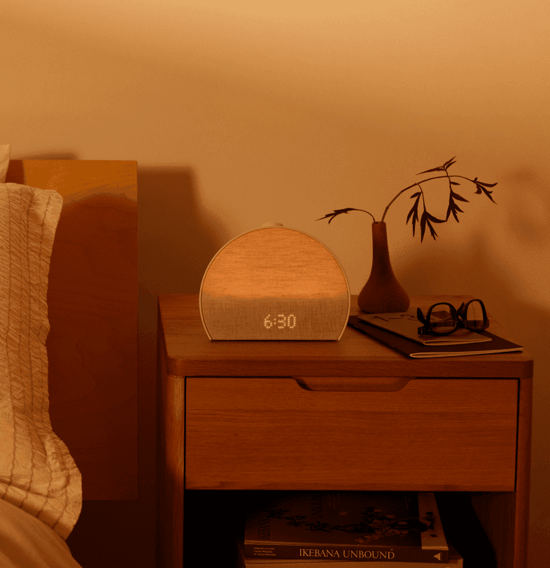 Restore 3 on a nightstand in the evening with meditative effects radiating from it