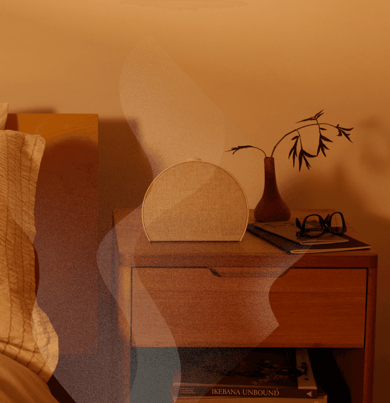 Restore 3 on a nightstand in the morning with coffee aroma effects radiating from it
