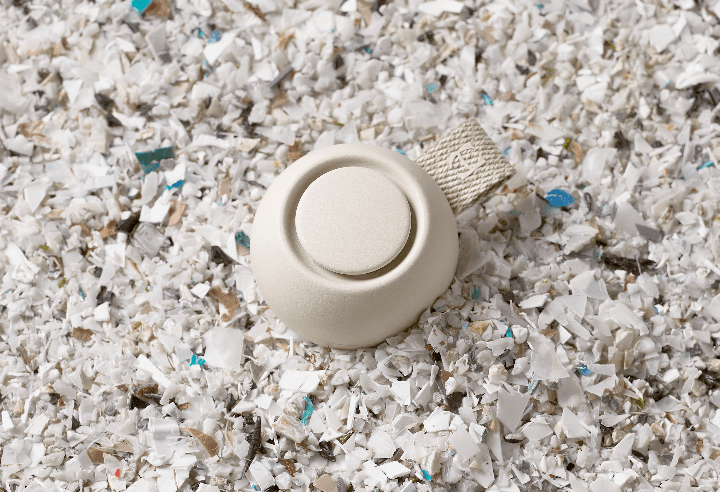Hatch Go laying on a bed of recycled plastic scraps