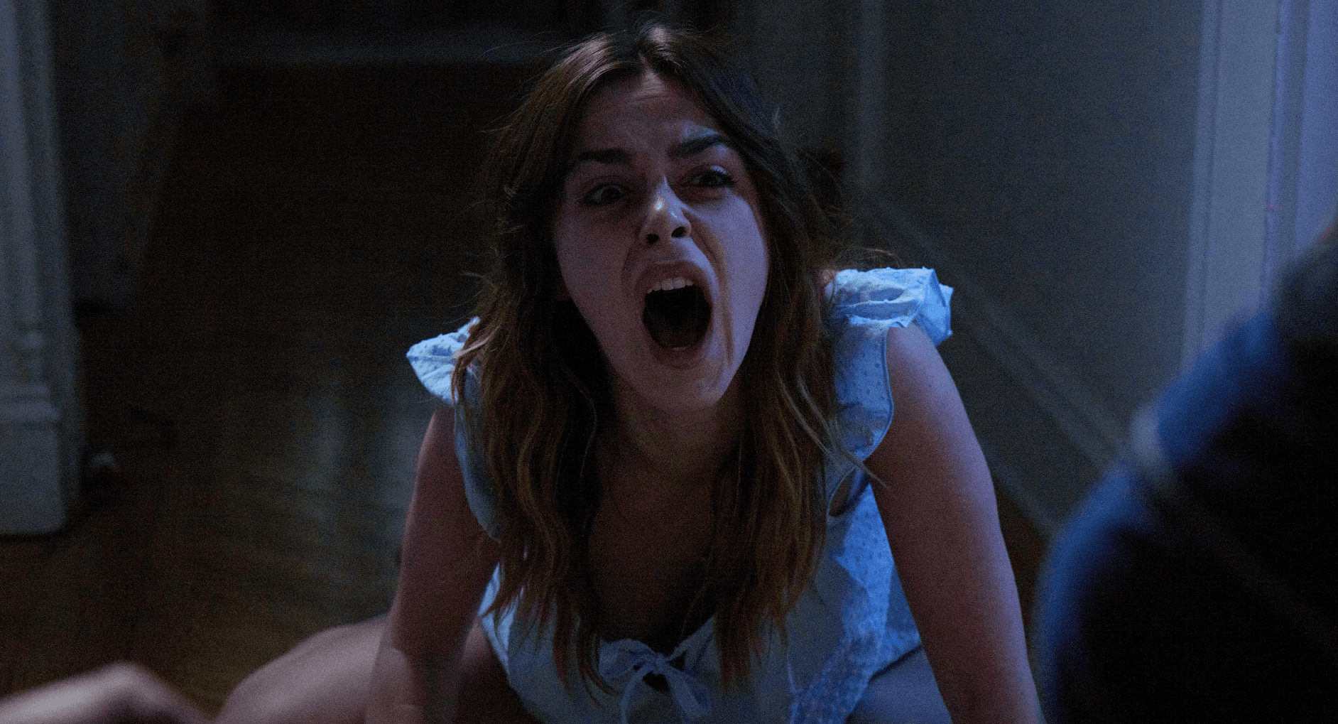 Woman fallen over, screaming in terror