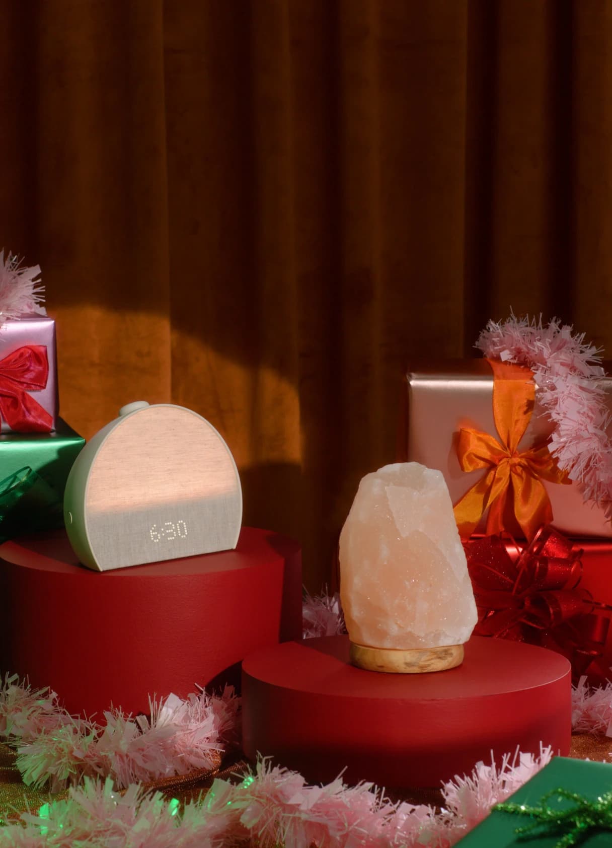 Hatch Restore 3 on a holiday pedestal next to gifts and a crystal