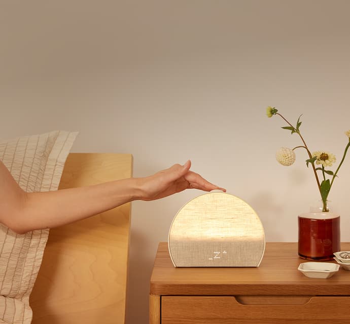 hand pressing Restore button