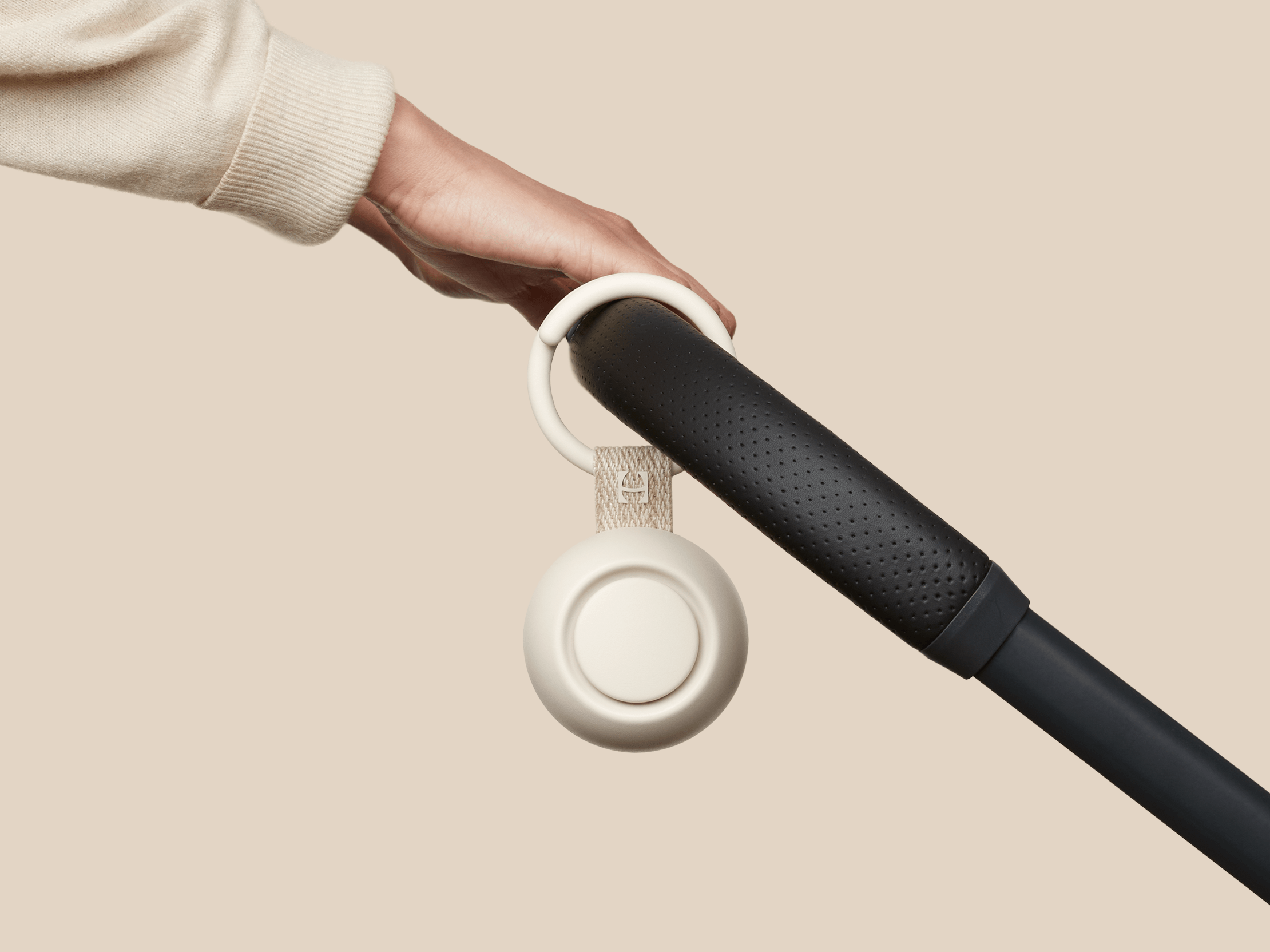 Hatch Go putty colorway clipped to baby stroller