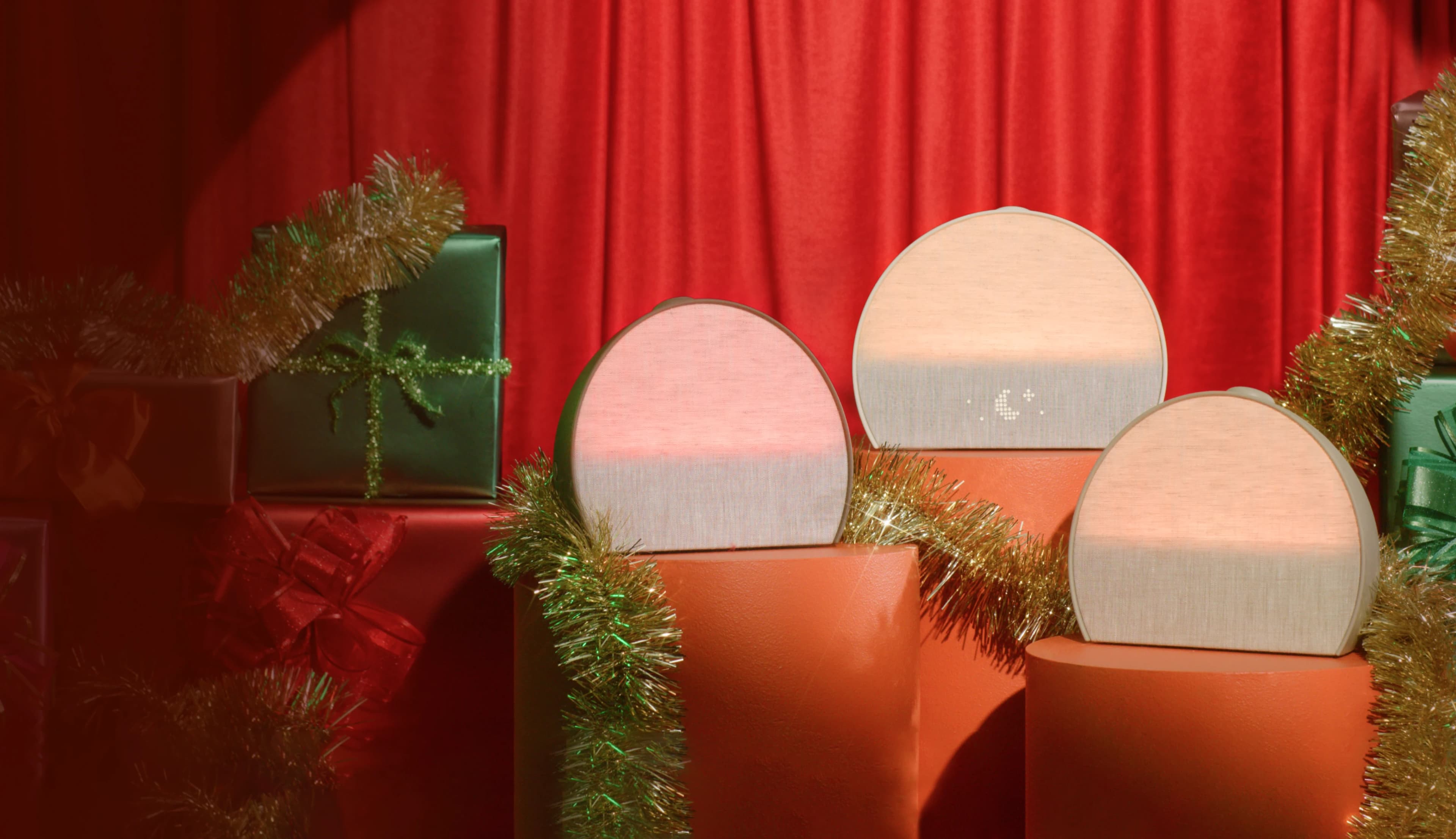 3 Hatch Restore colorways sitting on holiday presents with tinsel wrapped around